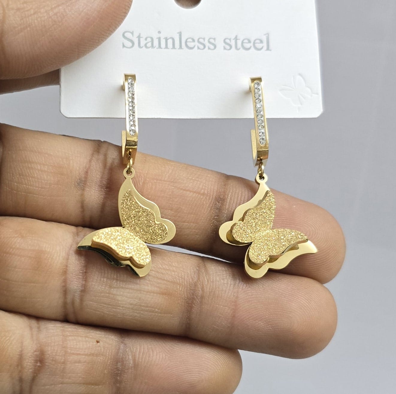Golden stainless steel butterfly drop earrings