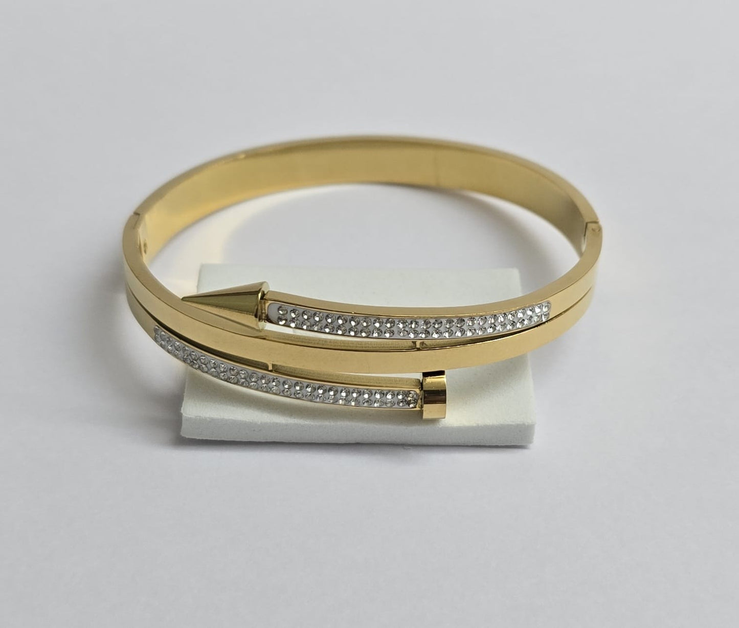Elegant Gold-Tone Arrow Bangle with Crystal Embellishments