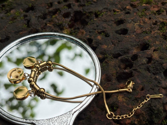 Golden Charm Bracelet with Playful Smiley Face - Everyday Elegance